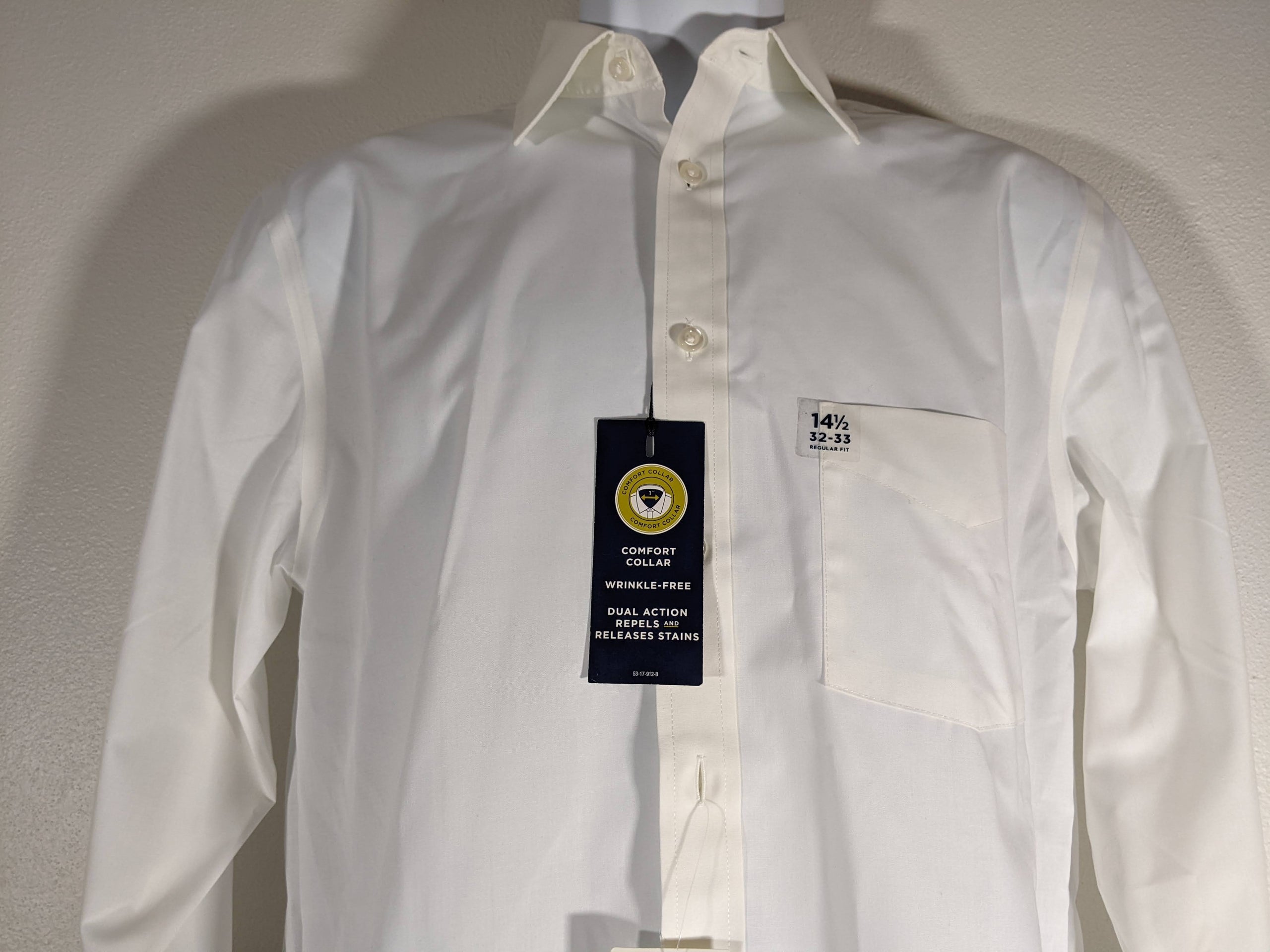 A Men's White Button-Down Travel Performance Super Shirt by Stafford. 