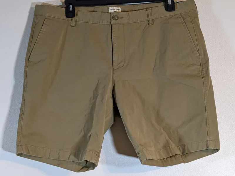 A tan pair of men's size 40 khaki shorts by Dockers.