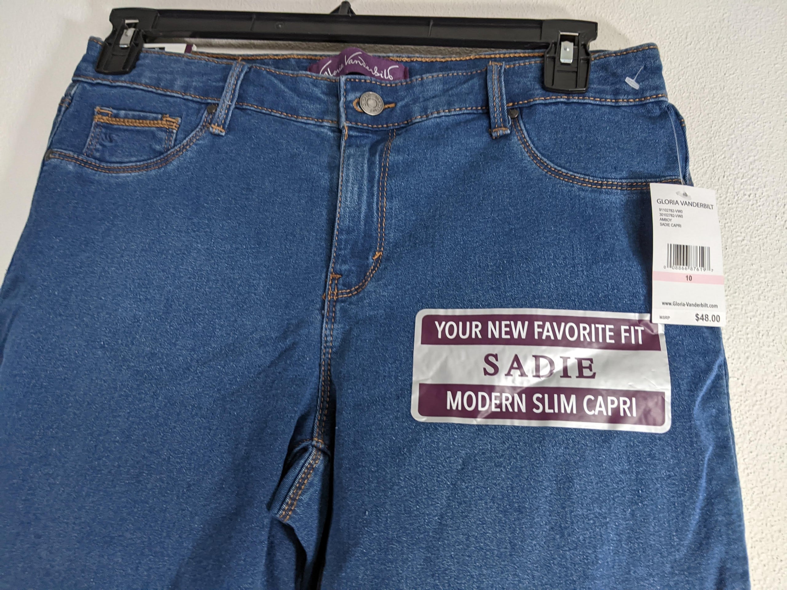 A pair of blue denim slim capri jeans by Gloria Vanderbilt for women.
