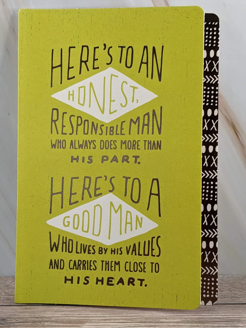 A Hallmark birthday greeting card for a guy with a green cover and a message about a good man.