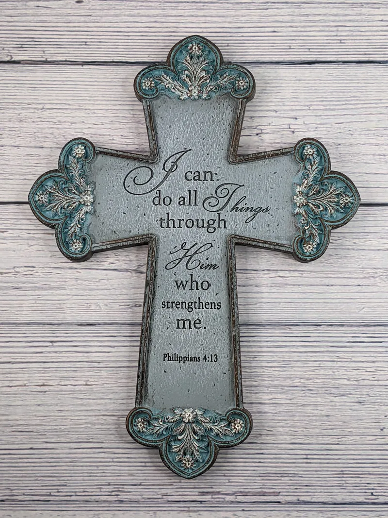 A gray and aqua wall cross with a Bible verse from Philippians 4:13.
