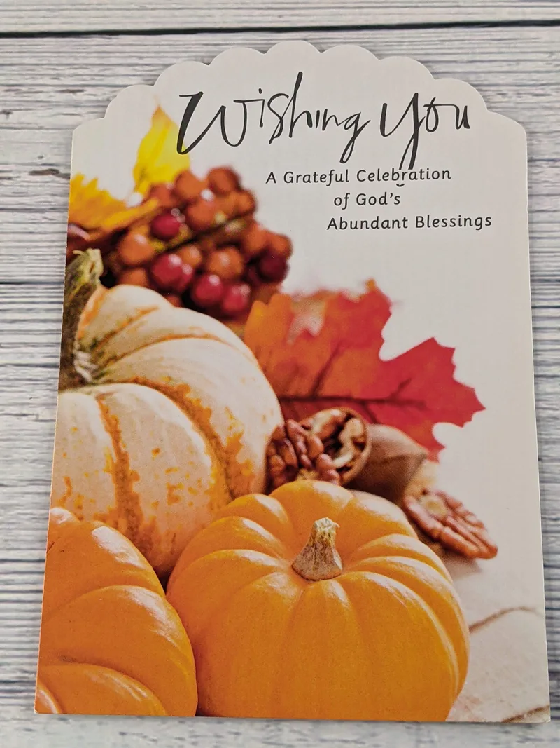 A Thanksgiving card with an image of pumpkins on the cover and a religious sentiment.