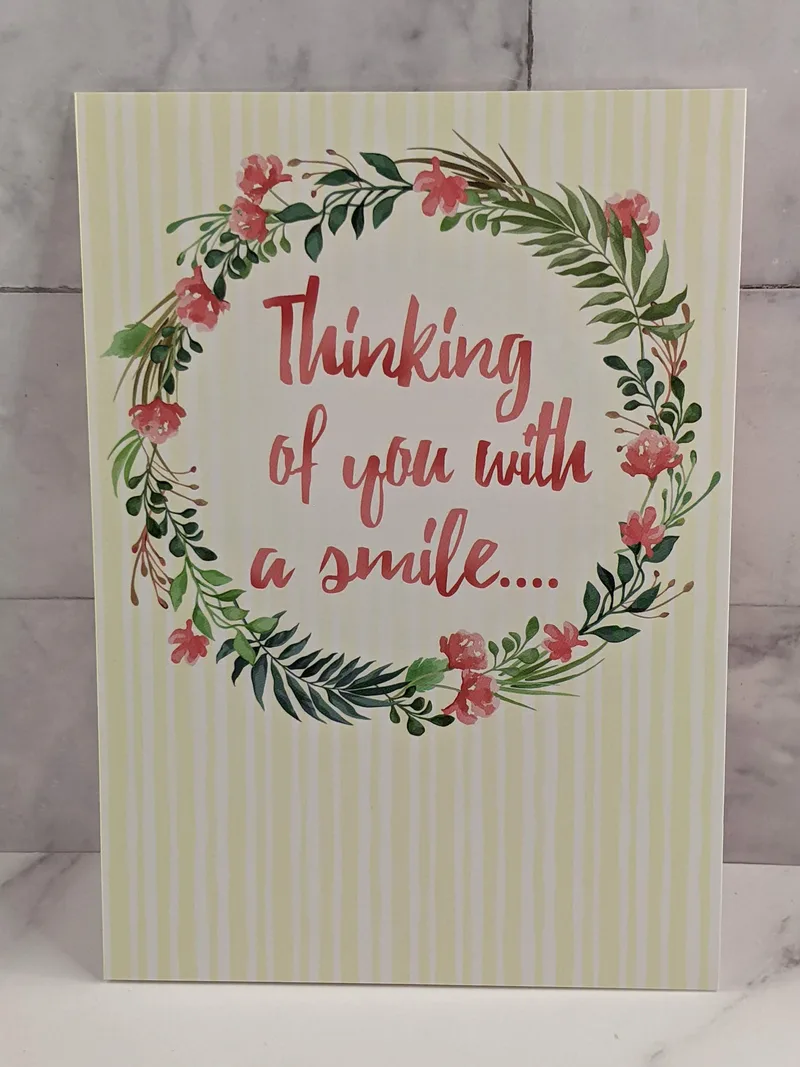 A greeting card for a Secret Sister with an image of a floral wreath and a happy sentiment.