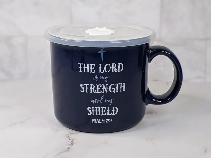 A dark blue ceramic soup mug, featuring a Bible verse, with plastic vented lid.