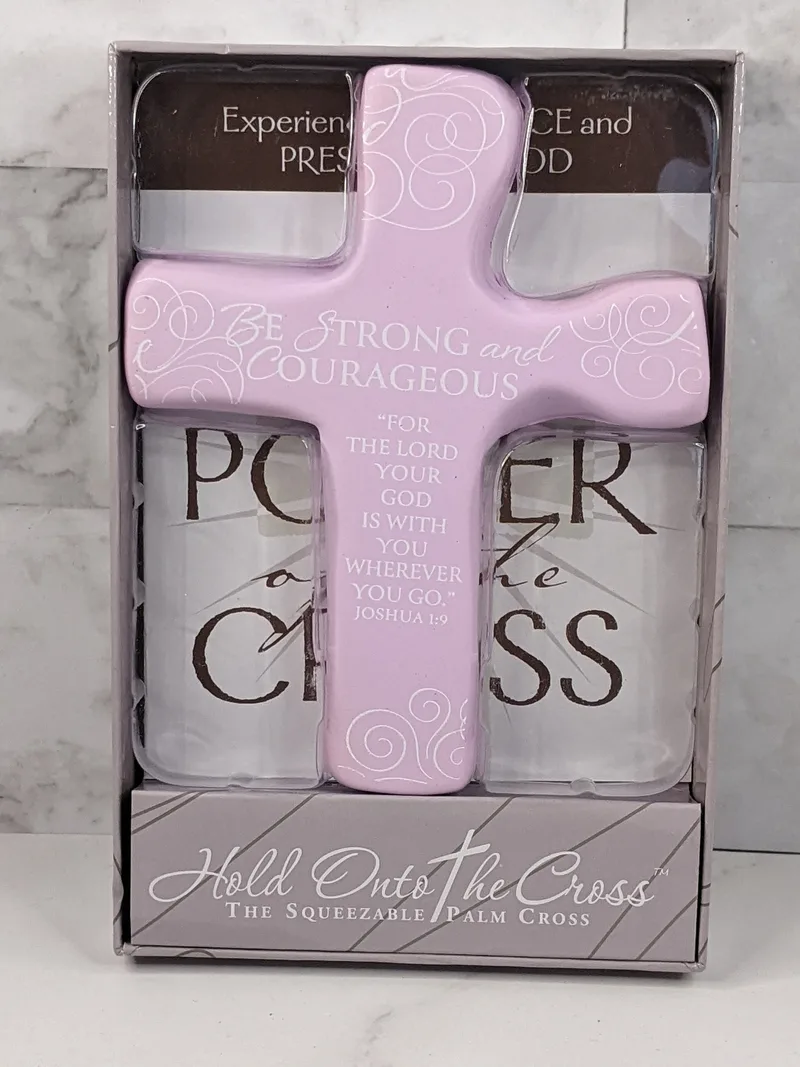 A small gift book, The Power of the Cross, that comes with a squeezable light purple cross.