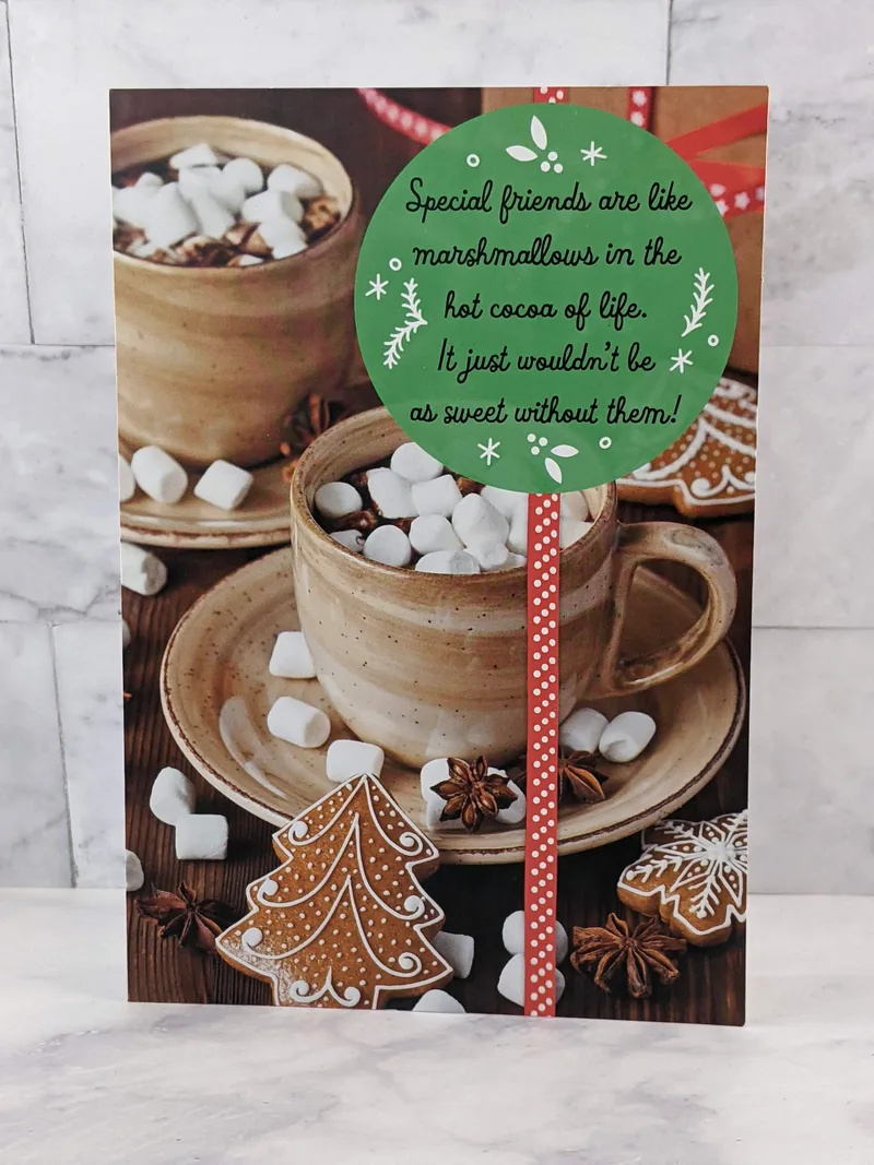 A religious Christmas card for a friend with an image of two mugs full of cocoa and marshmallows.