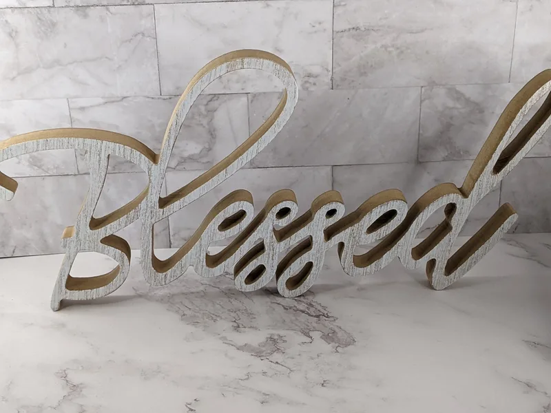 This home decor sign features the word, "Blessed."