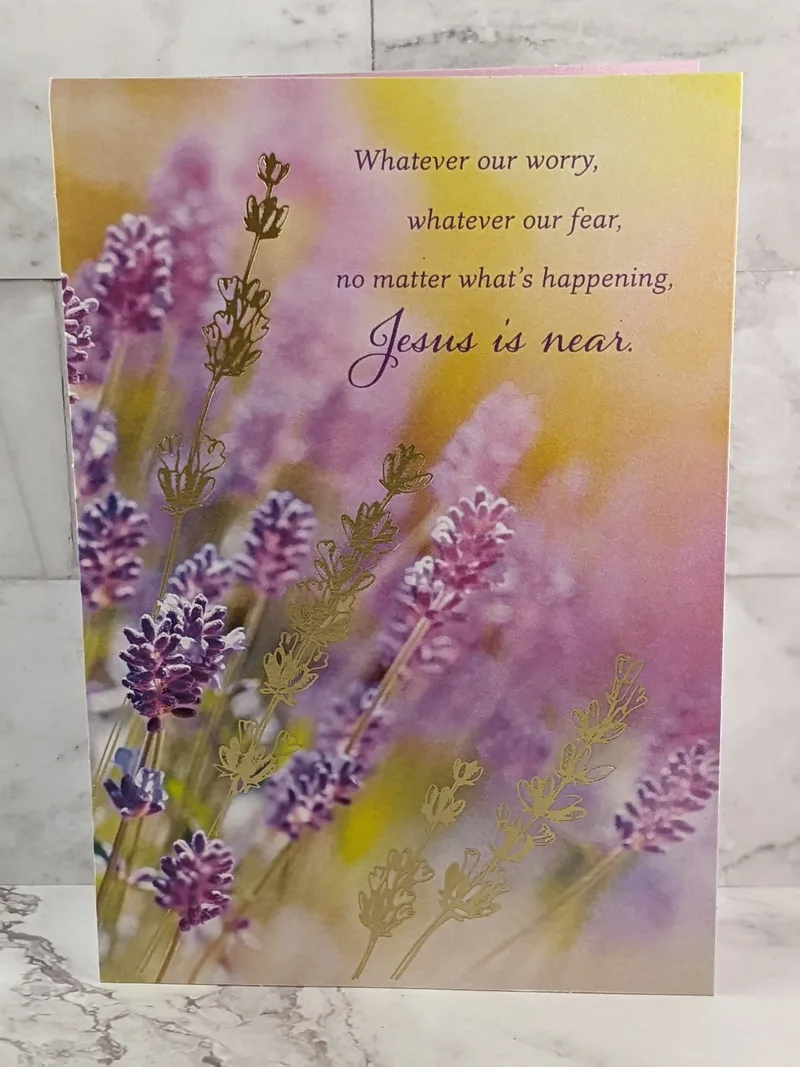 A religious greeting card with a golden cover with an image of lavender flowers and a Christian message of hope.