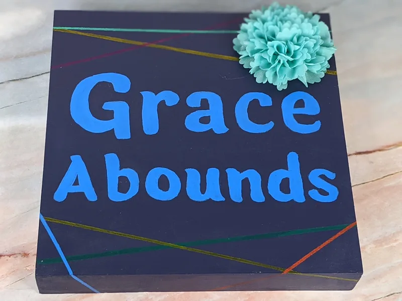 Grace Abounds Sign with Flower