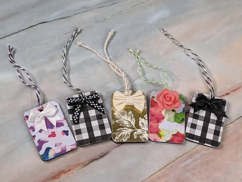 A set of five reusable gift tags with patterned designs on one side, and a chalkboard on the back.