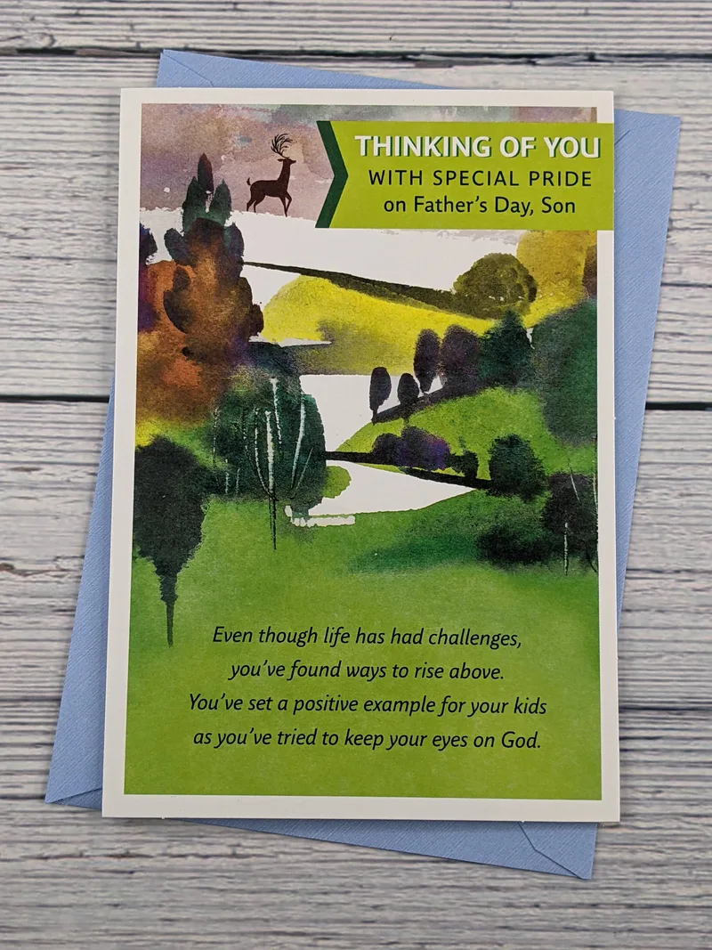 A Dayspring Father's Day greeting card for a son, featuring an image of trees, grass, and a deer.