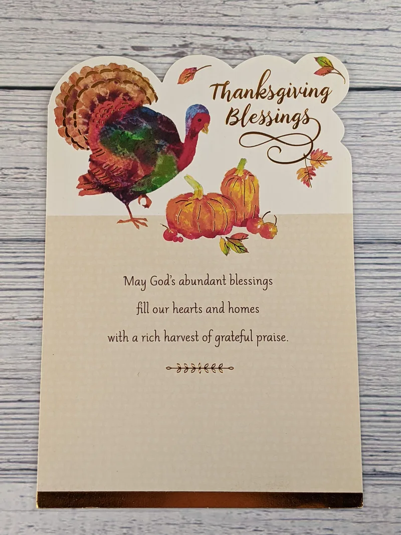A religious Thanksgiving card with an image of a turkey and pumpkins.