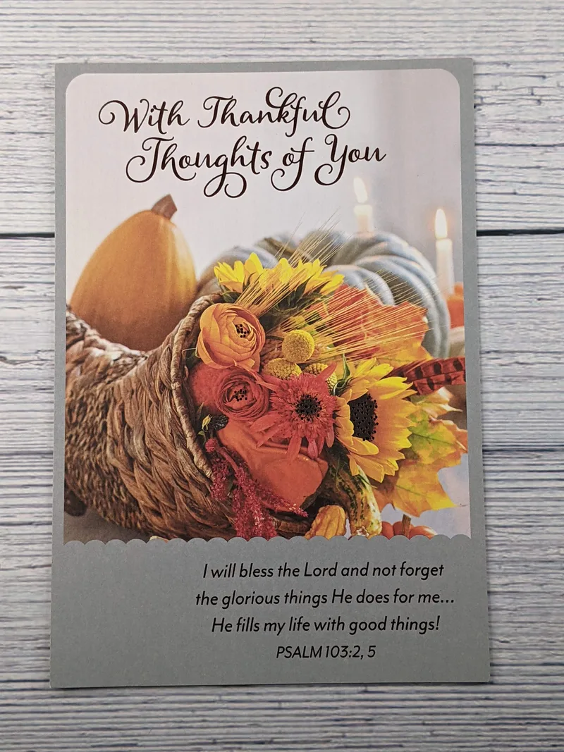 A Thanksgiving card with an image of a cornucopia and a Bible verse.