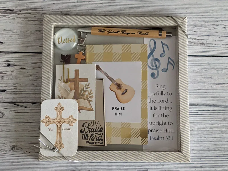 A Christian gift set in a box that is music themed for a worship leader in a church. 