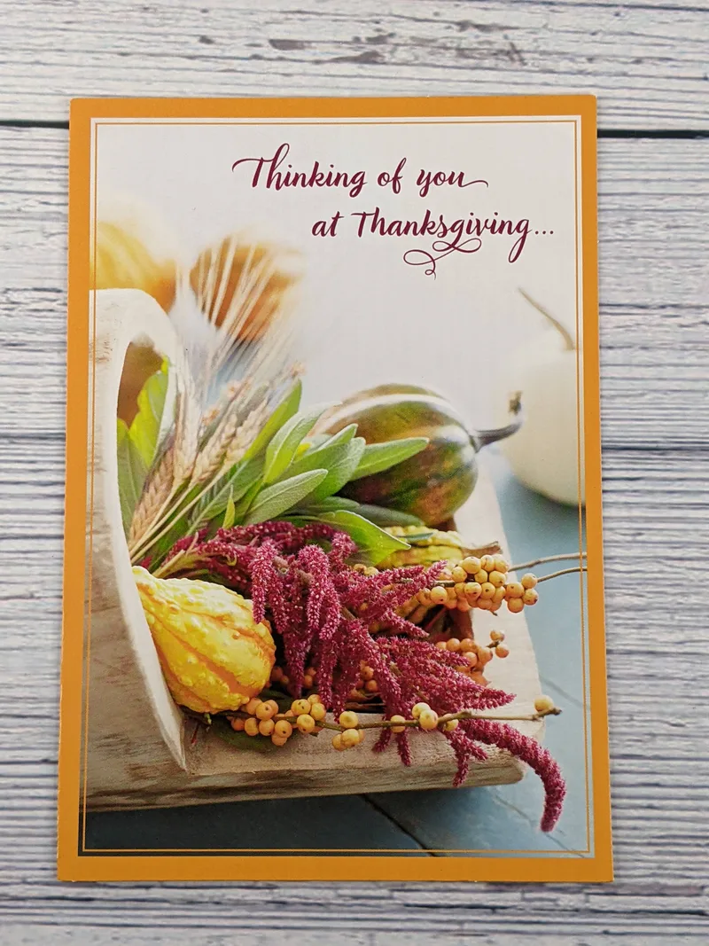 A religious thanksgiving card with an image of a bountiful harvest.