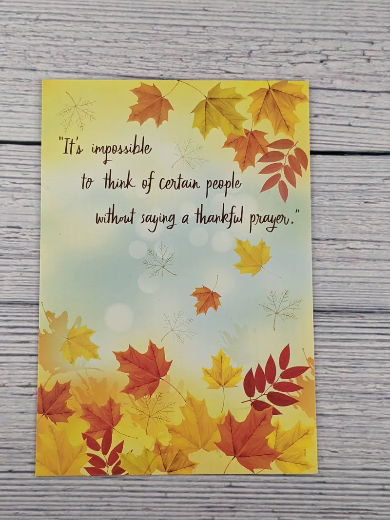 A Christian Thanksgiving greeting card with images of autumn leaves and a religious sentiment.