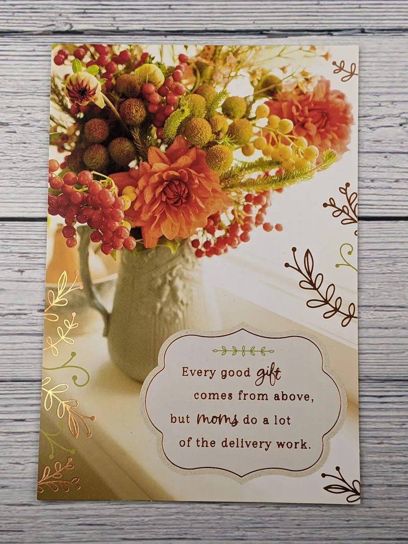 A thanksgiving card for a mother with an image of a green vase with orange flowers.