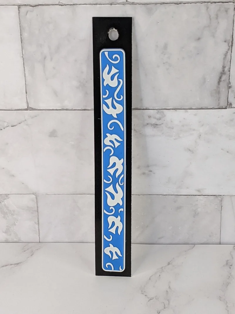A flexible blue bookmark with a design of white doves.