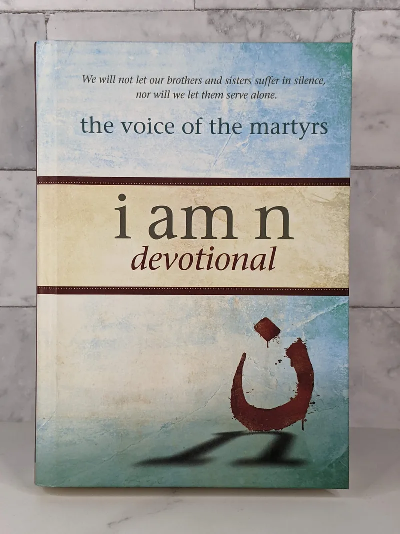 A blue hardcover book titled I Am N Devotional.