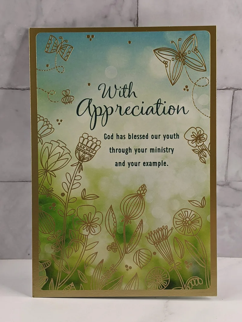 A youth ministry appreciation card with a blue and green cover that has gold accents.