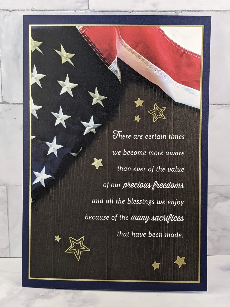A Veteran's Day greeting card with an image of an American flag.