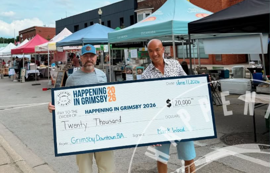 Grimsby Downtown BIA presents a $20,000 cheque to Happening in Grimsby in June 2026