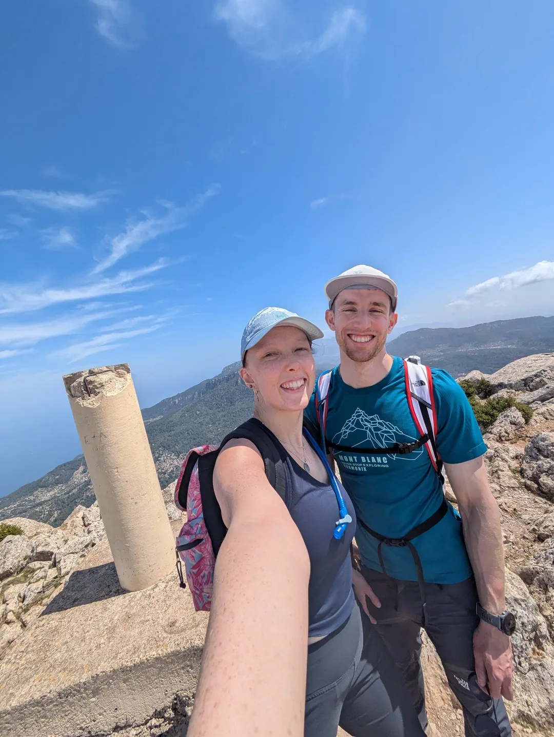Two hikers on the summit