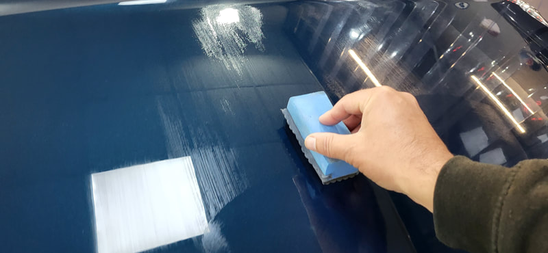 Ceramic Coating being applied to bonnet of Bentley at DMD Car Detailing