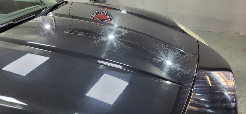Jaguar XKR bonnet showing swirl marks