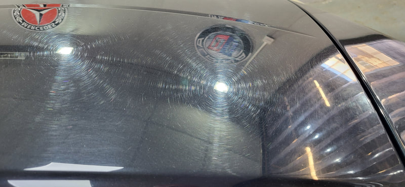 Close up of Jaguar XKR bonnet showing swirl marks