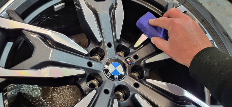 BMW alloy wheel being ceramic coated at DMD Car Detailing near Greenock