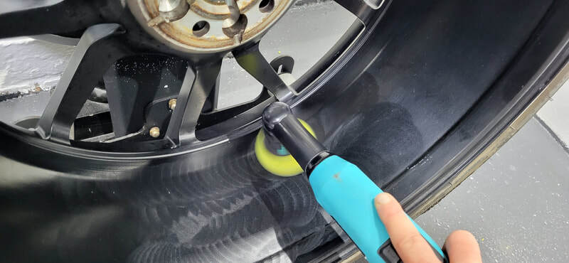 Alloy wheel being polished ahead of ceramic coating application