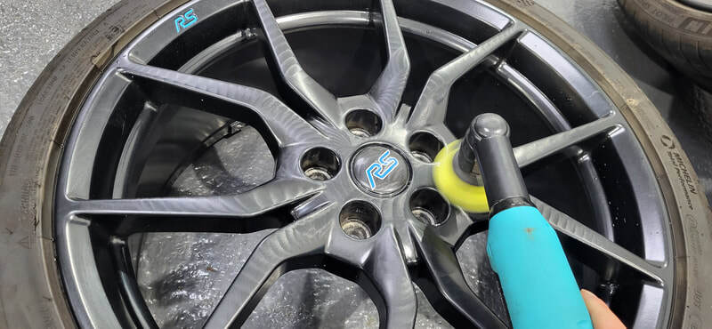 Alloy wheel being polished ahead of ceramic coating application in Paisley at DMD Car Detailing
