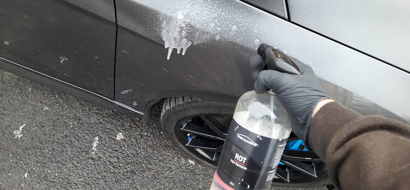 Paintwork on the Ford Focus RS going through chemical decontamination process