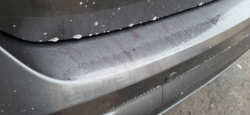 Fallout remover (or iron remover) dissolving bonded ferrous metal particles—such as industrial fallout, rail dust, and brake dust from the Focus RS paintwork