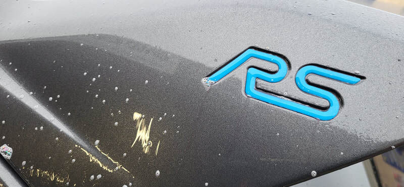 Fallout remover (or iron remover) dissolving bonded ferrous metal particles—such as industrial fallout, rail dust, and brake dust from the Ford Focus RS paintwork