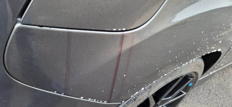 Fallout remover (or iron remover) dissolving bonded ferrous metal particles—such as industrial fallout, rail dust, and brake dust from the Ford Focus RS paintwork in Paisley