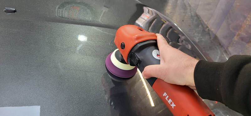 Machine polishing Ford Focus RS bonnet during minor paint correction