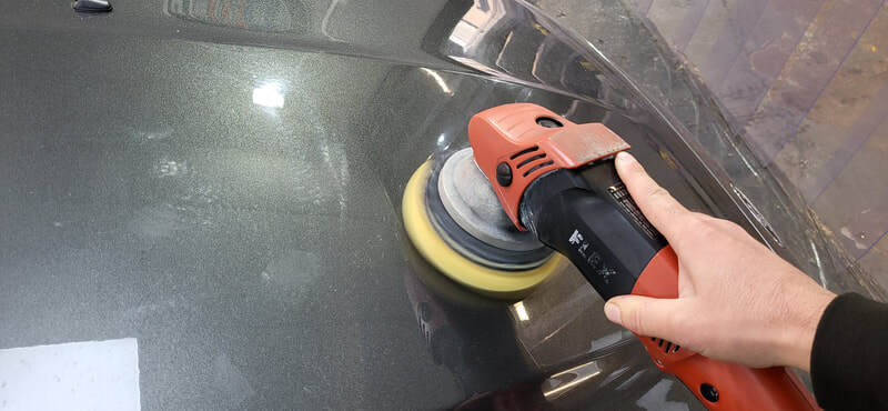 Machine polishing Ford Focus RS bonnet during minor paint correction in Paisley at DMD Car Detailing