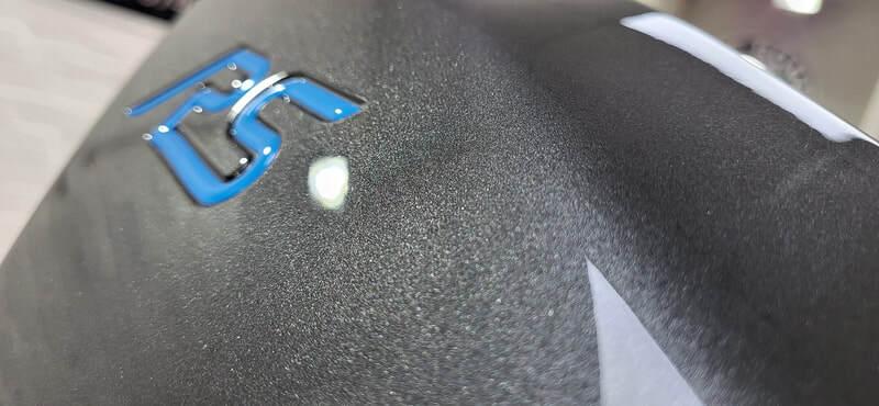 Close-up of corrected paintwork showing improved clarity and gloss