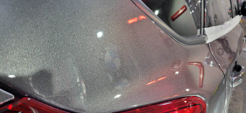 Close-up of corrected paintwork showing improved clarity and gloss at DMD Car Detailing
