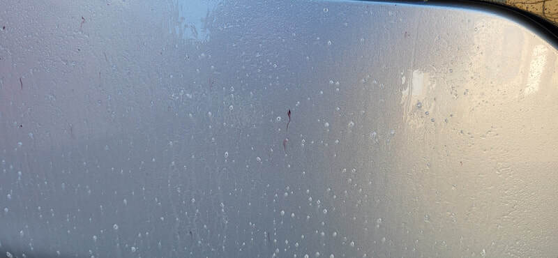 Fallout remover breaking down and removing embedded iron and metal contamination from the KIA paintwork