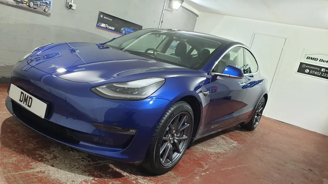 Glossy finish on blue Tesla Model 3 after New Car Ceramic Coating service