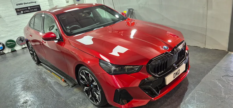 BMW i5 in Fire Red after New Car Ceramic Coating in Paisley near Glasgow by DMD.