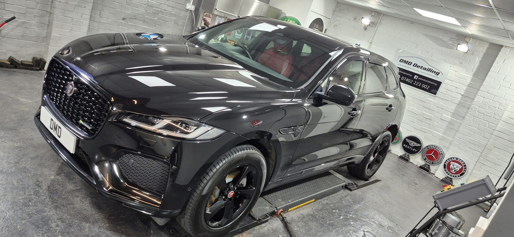 Santorini Black Jaguar F-Pace after undergoing major paint correction and ceramic coating in Paisley at DMD Car Detailing near Glasgow