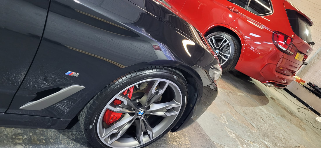 BMW M550i and BMW X5M in DMD Car Detailing workshop after paint correction