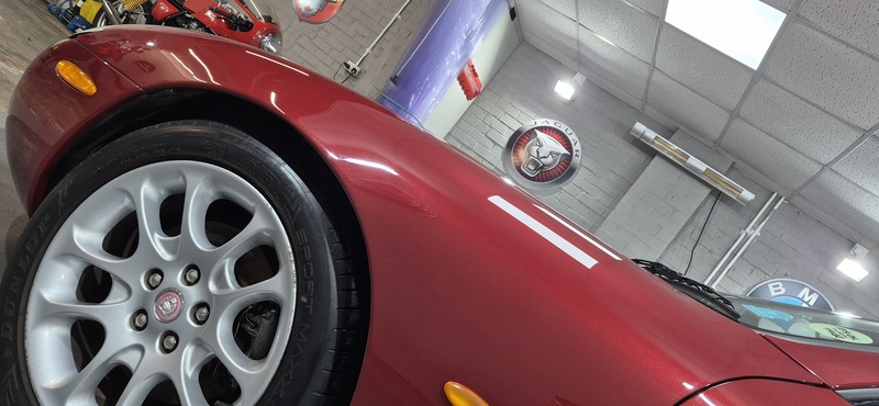 Carnival Red Jaguar XKR 4.0 after paint enhancement detail in Paisley workshop