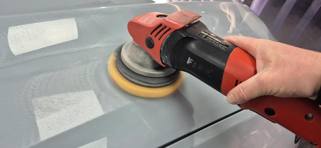 Machine polisher being used on BMW X4 bonnet during single stage polish