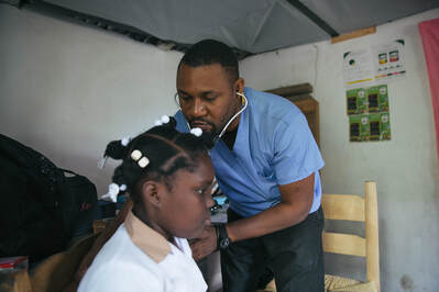 nurse treating a student at Rodaille school