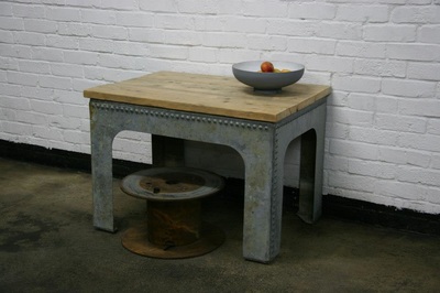 An upcycled water tank coffee table